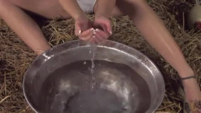 Terezie washes her body in a barn and toys her virgin pussy