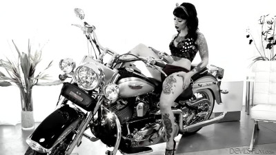 Voluptuous and tattooed pin-up mom Dollie Darko is boned on a chopper