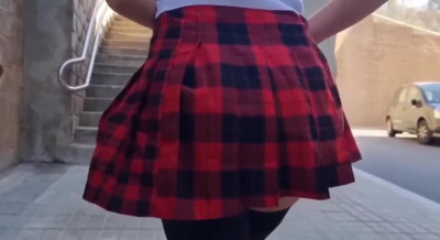 Beauty in a mini skirt squirts from a remote vibrator in a public place.