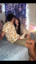 Latina and her bearded boyfriend making out on the bed before a deep blowjob