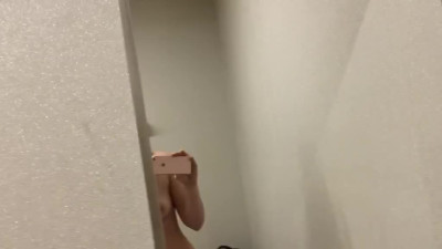 Horny MILF is not afraid of being caught masturbating in a public dressing room